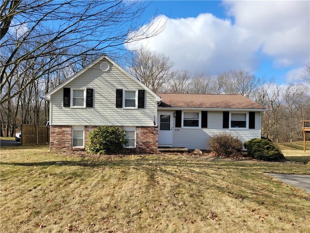 split level home with a front lawn