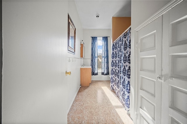 bathroom featuring vanity and walk in shower