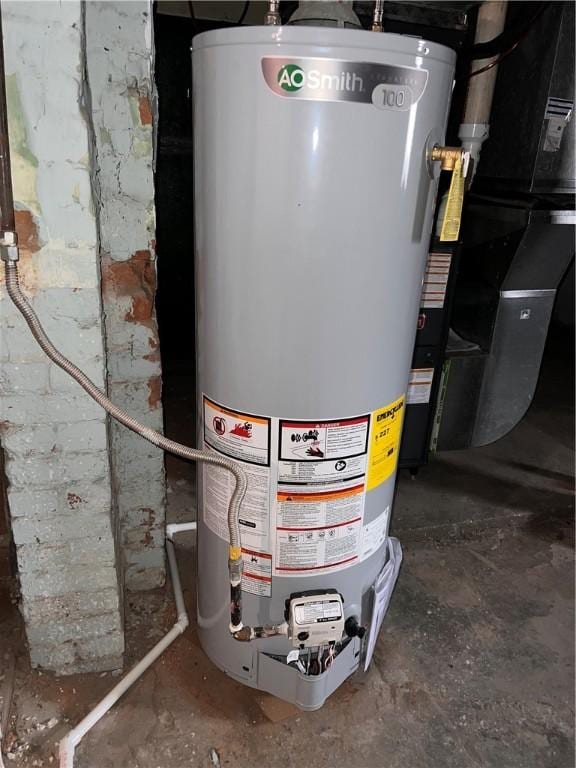 utility room featuring gas water heater