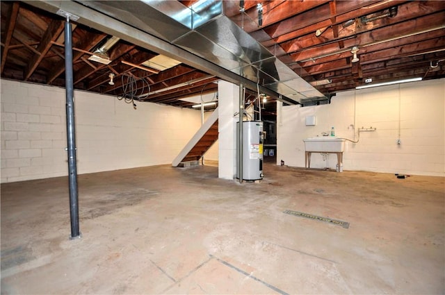 basement featuring sink and electric water heater