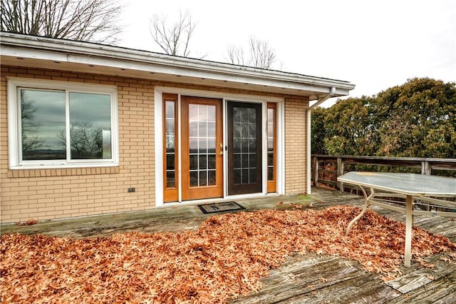 entrance to property featuring a deck