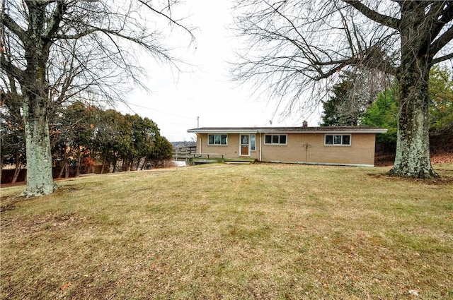 back of house with a yard