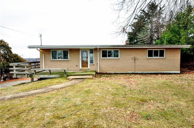 single story home featuring a front lawn