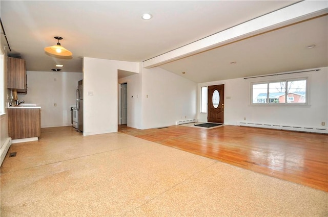 interior space with a baseboard heating unit and vaulted ceiling with beams