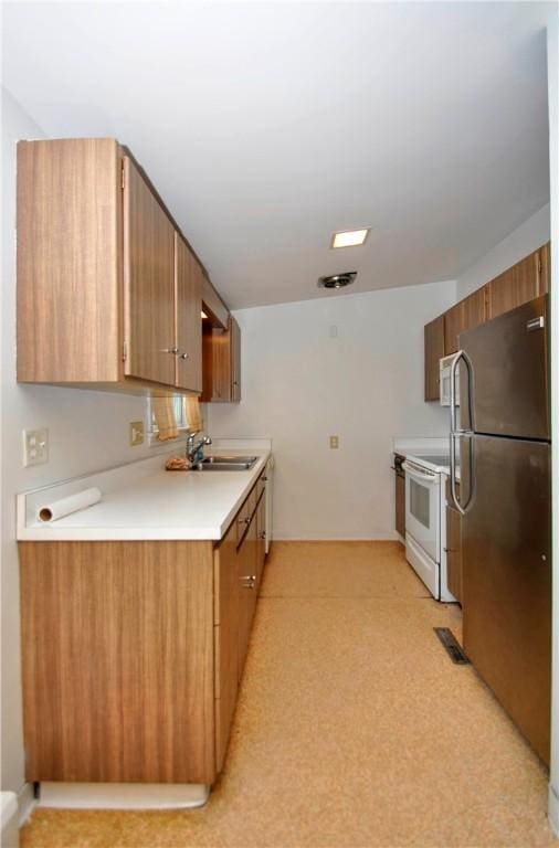 kitchen with sink and white appliances