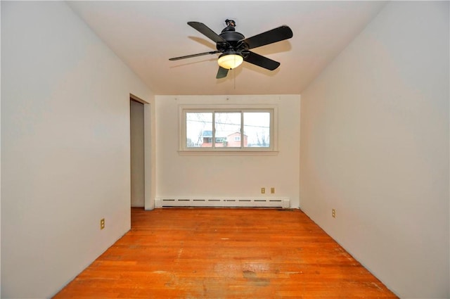 unfurnished room with ceiling fan, a baseboard radiator, and light hardwood / wood-style flooring