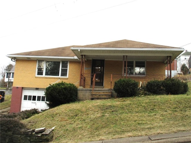 view of front of home featuring a garage and a front lawn