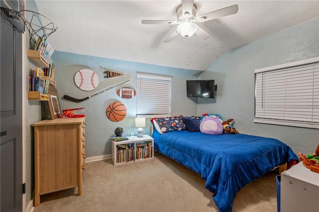 bedroom featuring lofted ceiling, light carpet, and ceiling fan