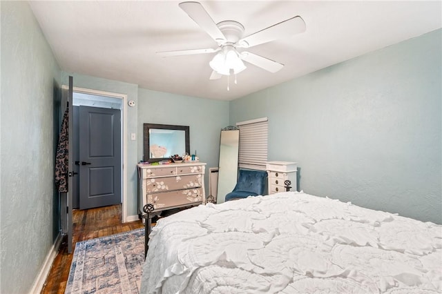 bedroom featuring ceiling fan and dark hardwood / wood-style flooring