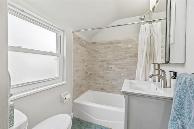 full bathroom featuring vanity, vaulted ceiling, shower / bathtub combination with curtain, and toilet