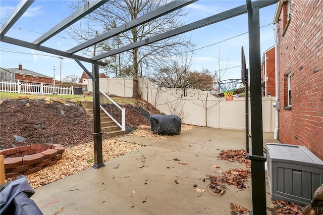 view of patio with a pergola and an outdoor fire pit