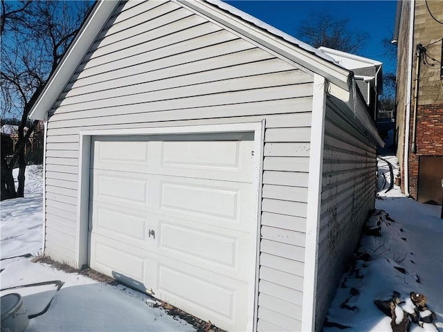 view of snow covered garage