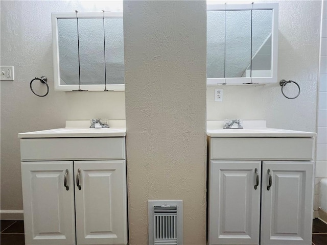 bathroom featuring vanity and tile patterned flooring