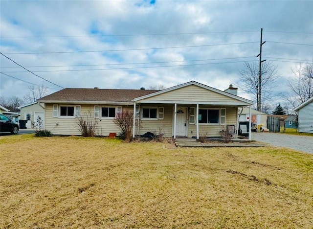 view of front of house with a porch and a front lawn