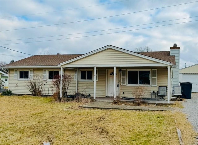 view of front of house featuring a front yard and covered porch