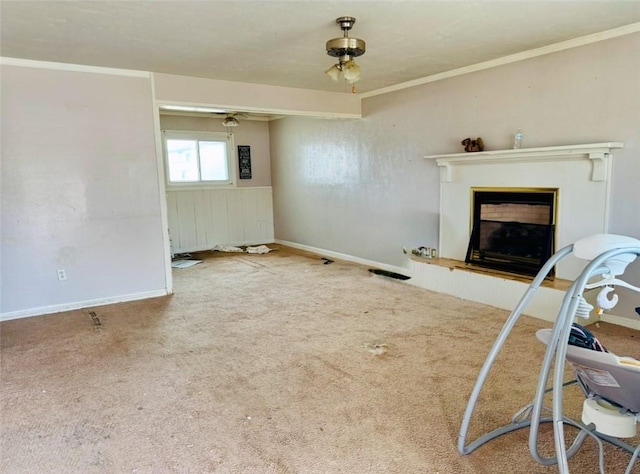 living room with ornamental molding and carpet