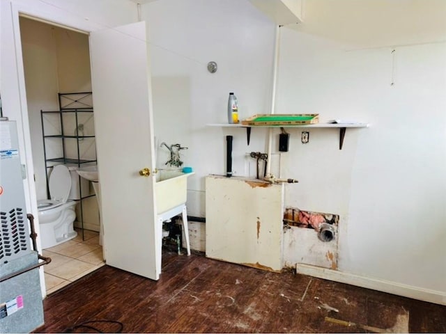 laundry area featuring dark hardwood / wood-style floors