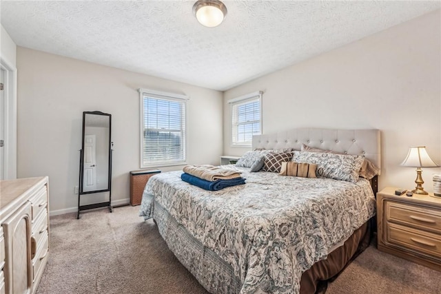 bedroom featuring carpet and a textured ceiling