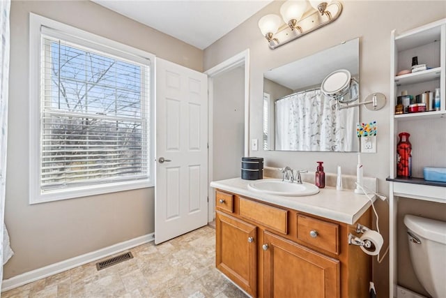 bathroom with vanity and toilet