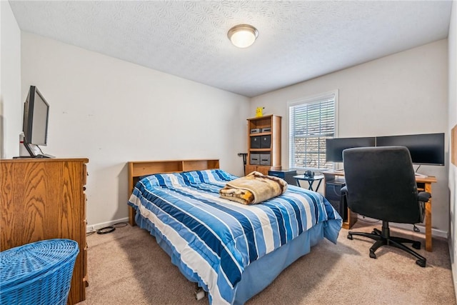 carpeted bedroom featuring a textured ceiling