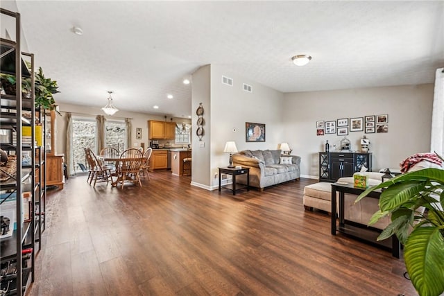 living room featuring dark hardwood / wood-style flooring