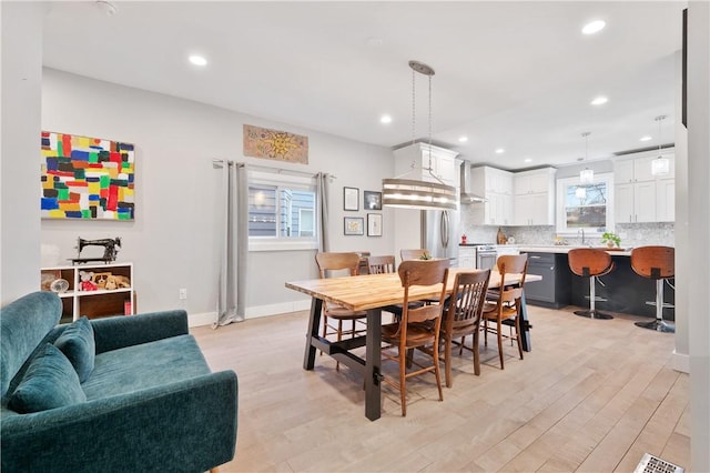 dining room with light hardwood / wood-style floors