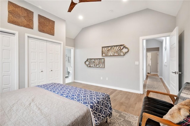 bedroom with lofted ceiling, hardwood / wood-style floors, and ceiling fan