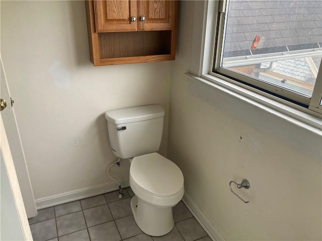 bathroom with tile patterned flooring and toilet