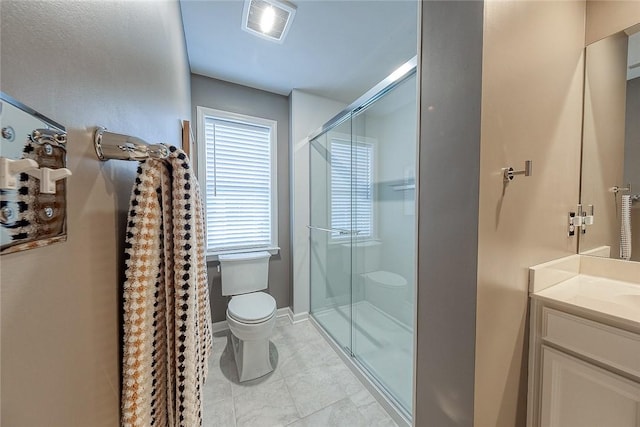 bathroom featuring vanity, toilet, tile patterned floors, and walk in shower