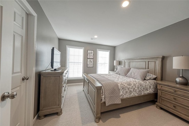 bedroom with light colored carpet