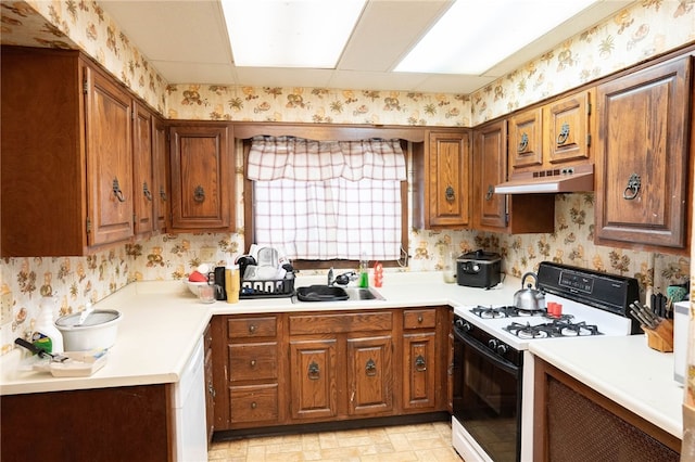 kitchen featuring sink and gas range oven