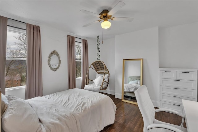 bedroom featuring dark hardwood / wood-style floors and ceiling fan