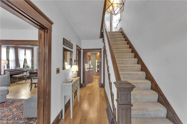 stairs with hardwood / wood-style floors