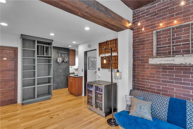 interior space featuring brick wall and light hardwood / wood-style floors