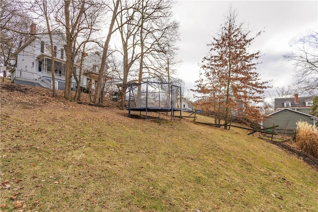 view of yard featuring a trampoline