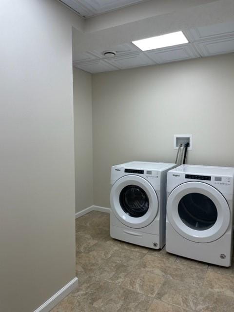 laundry area with washing machine and clothes dryer