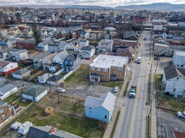 birds eye view of property with a mountain view