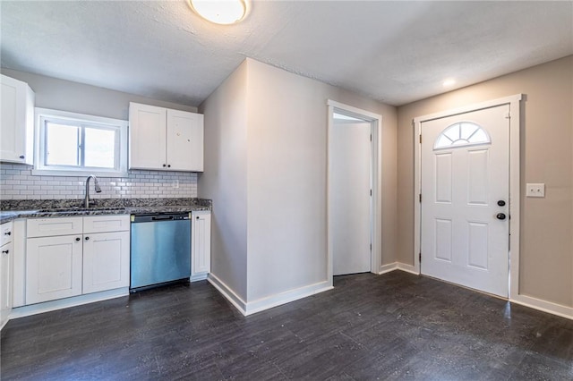 kitchen featuring sink, dark wood-type flooring, white cabinetry, backsplash, and stainless steel dishwasher