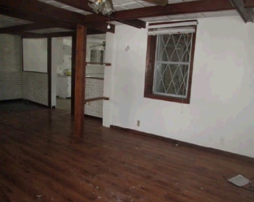 basement with dark wood-type flooring