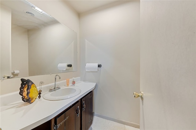 bathroom with tile patterned flooring and vanity