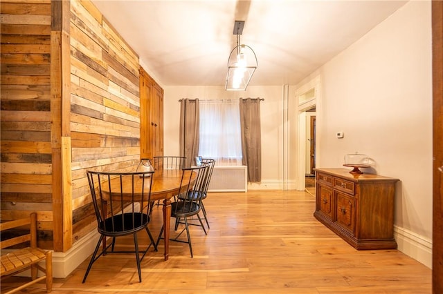 dining space with light hardwood / wood-style floors