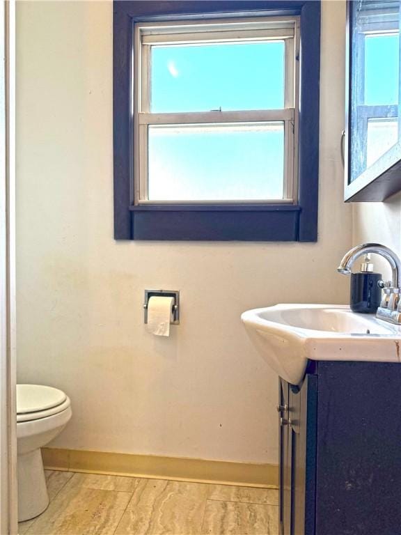 bathroom featuring sink and toilet