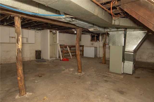 basement featuring heating unit