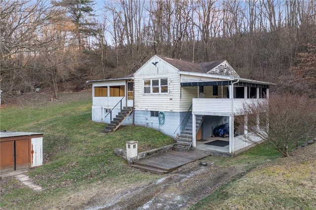 back of property with a storage shed and a yard