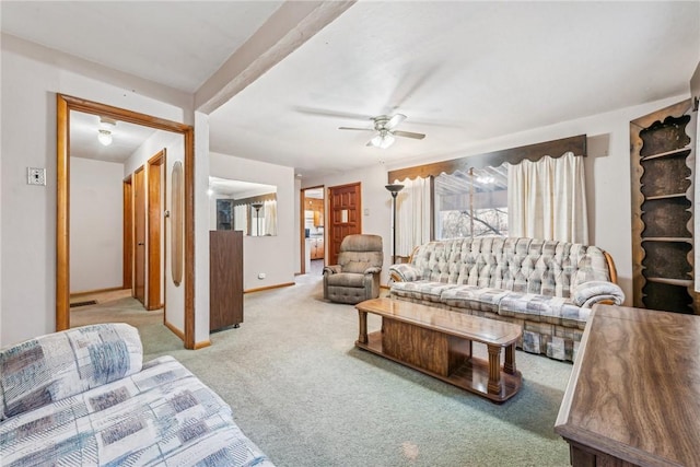 carpeted living room featuring ceiling fan