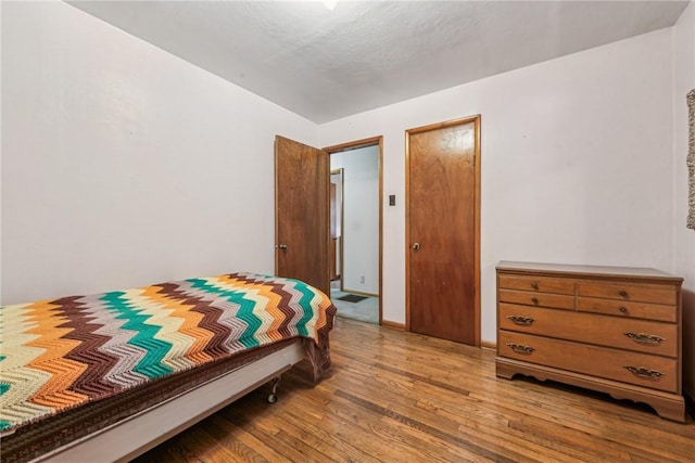 bedroom with light hardwood / wood-style floors