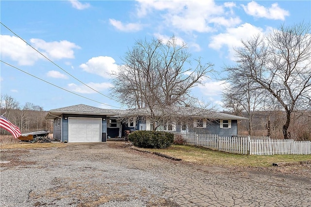 single story home featuring a garage