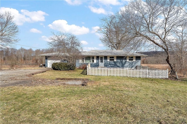 ranch-style house with a garage and a front yard