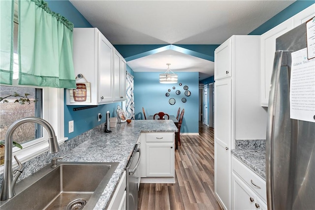 kitchen with decorative light fixtures, white cabinetry, sink, stainless steel appliances, and dark wood-type flooring