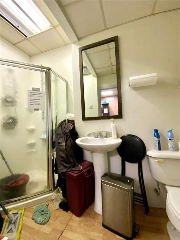 bathroom with toilet and walk in shower